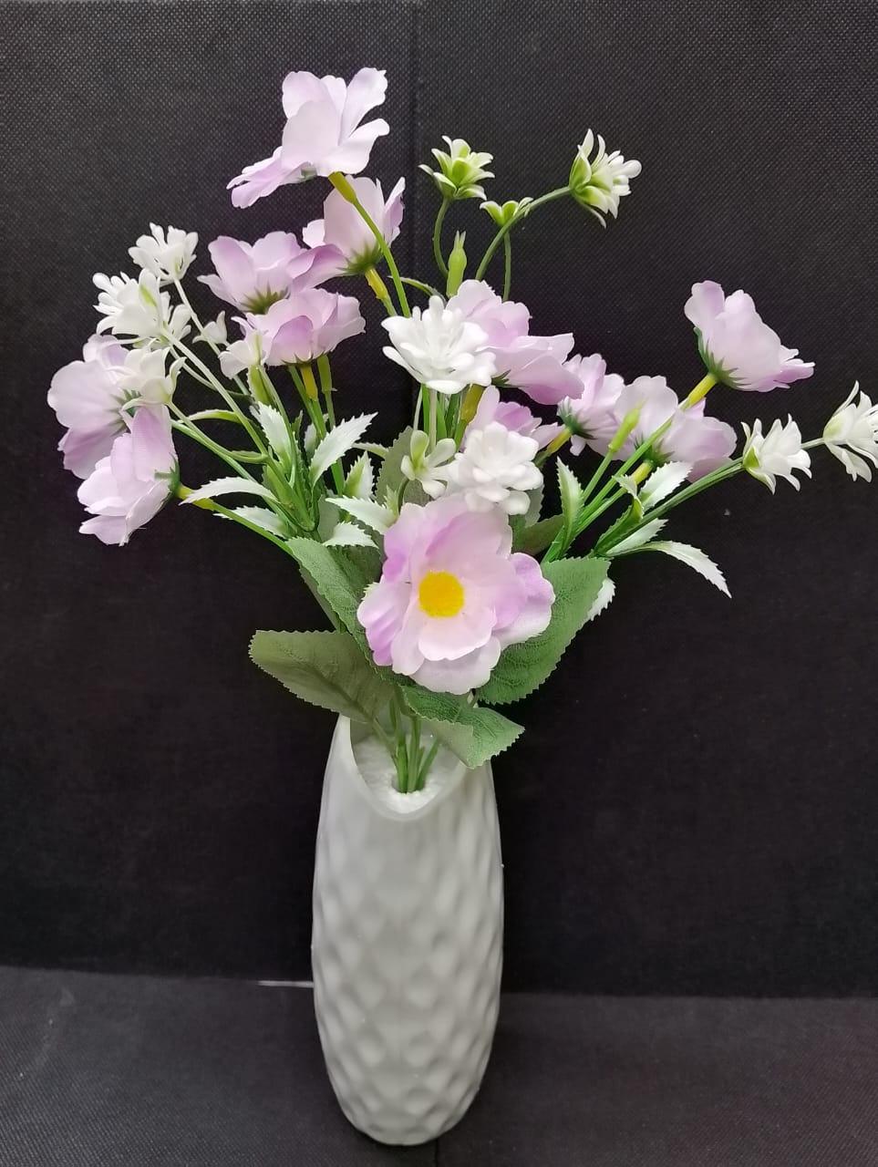Artificicial Bail Table Top Flower  . The artificial plant needs low maintenance  since it requires no sunlight or water. It does not only enhance aesthetics but also promoting sustainable environment