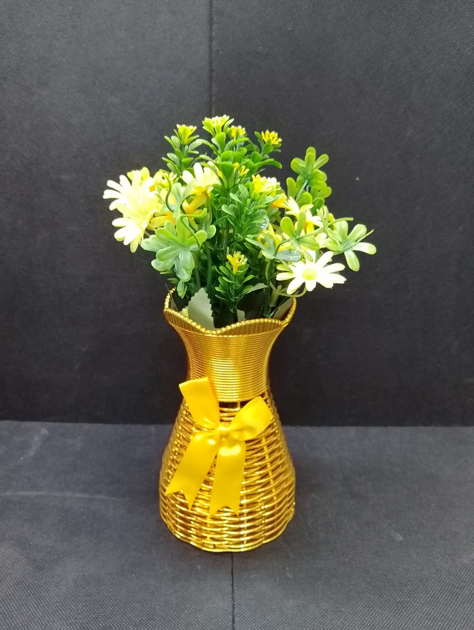 Artificicial Bail Table Top Flower  This beautifully piece adds a touch of nature and elegance to any room, creating a soothing and inviting atmosphere. The realistic design makes it a perfect piece f