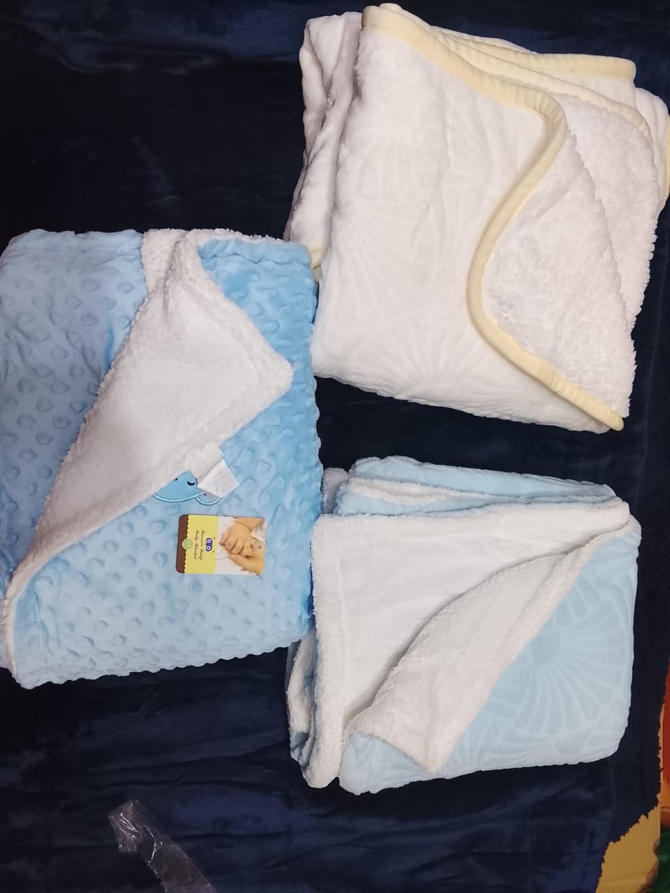 Heavyshawls  The fleece material is soft and warm hence ideal for a new born and infants.The blanket  can also be used to cover the infant on all occasions