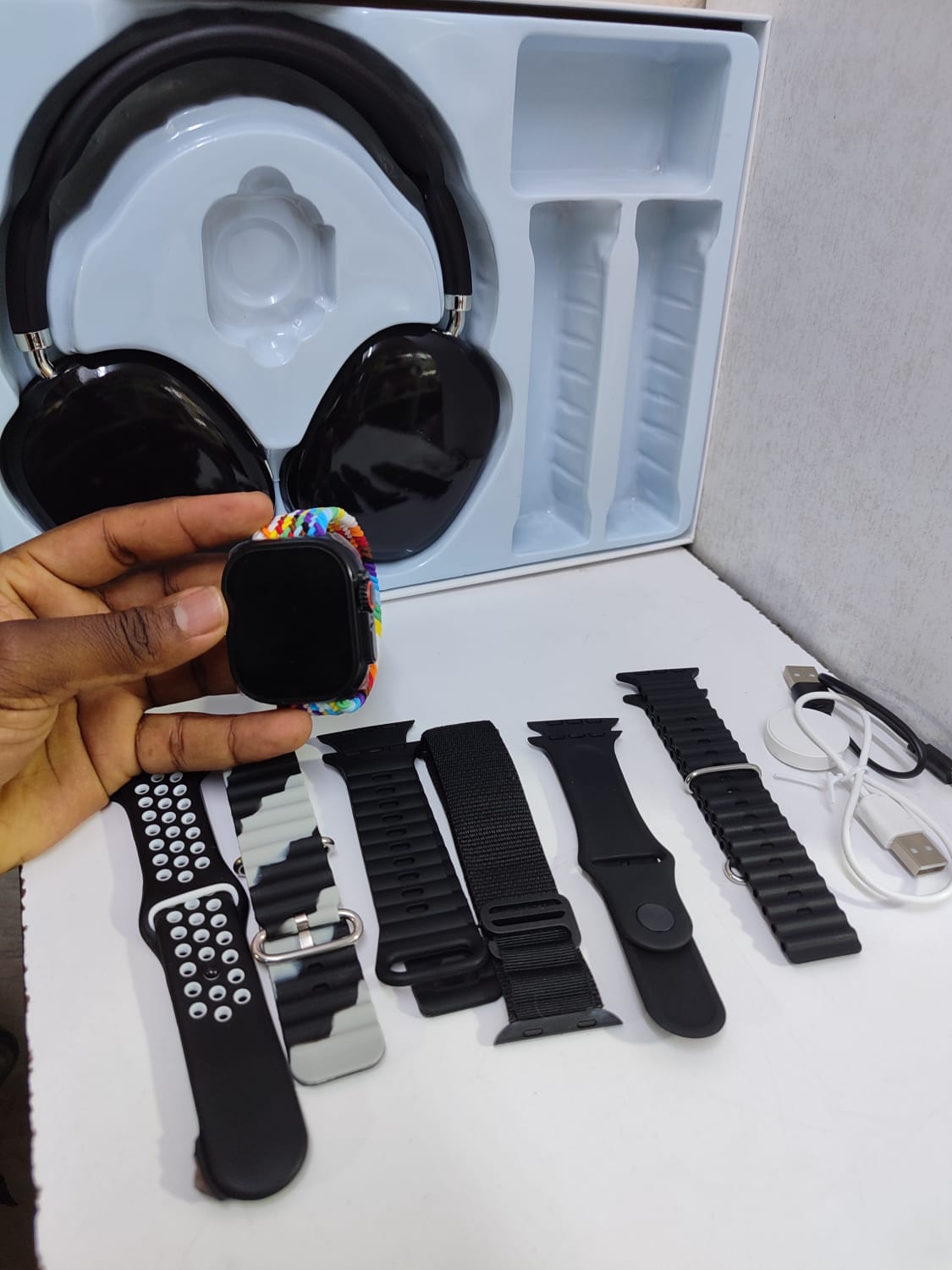 9-in-1 Ultra 2 smartwatch with 7 interchangeable straps and P9 Bluetooth headphones