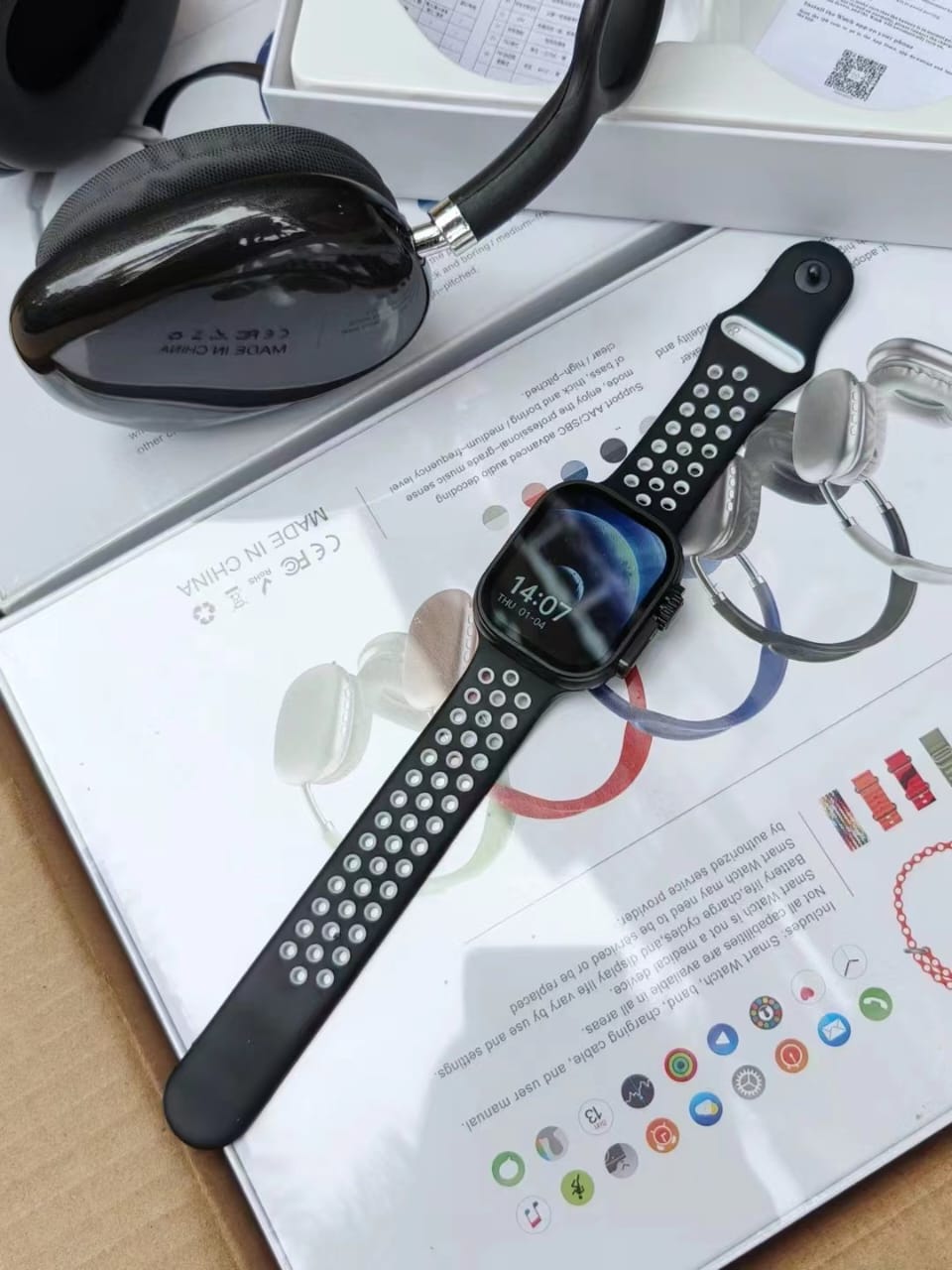 9-in-1 Ultra 2 smartwatch with 7 interchangeable straps and P9 Bluetooth headphones