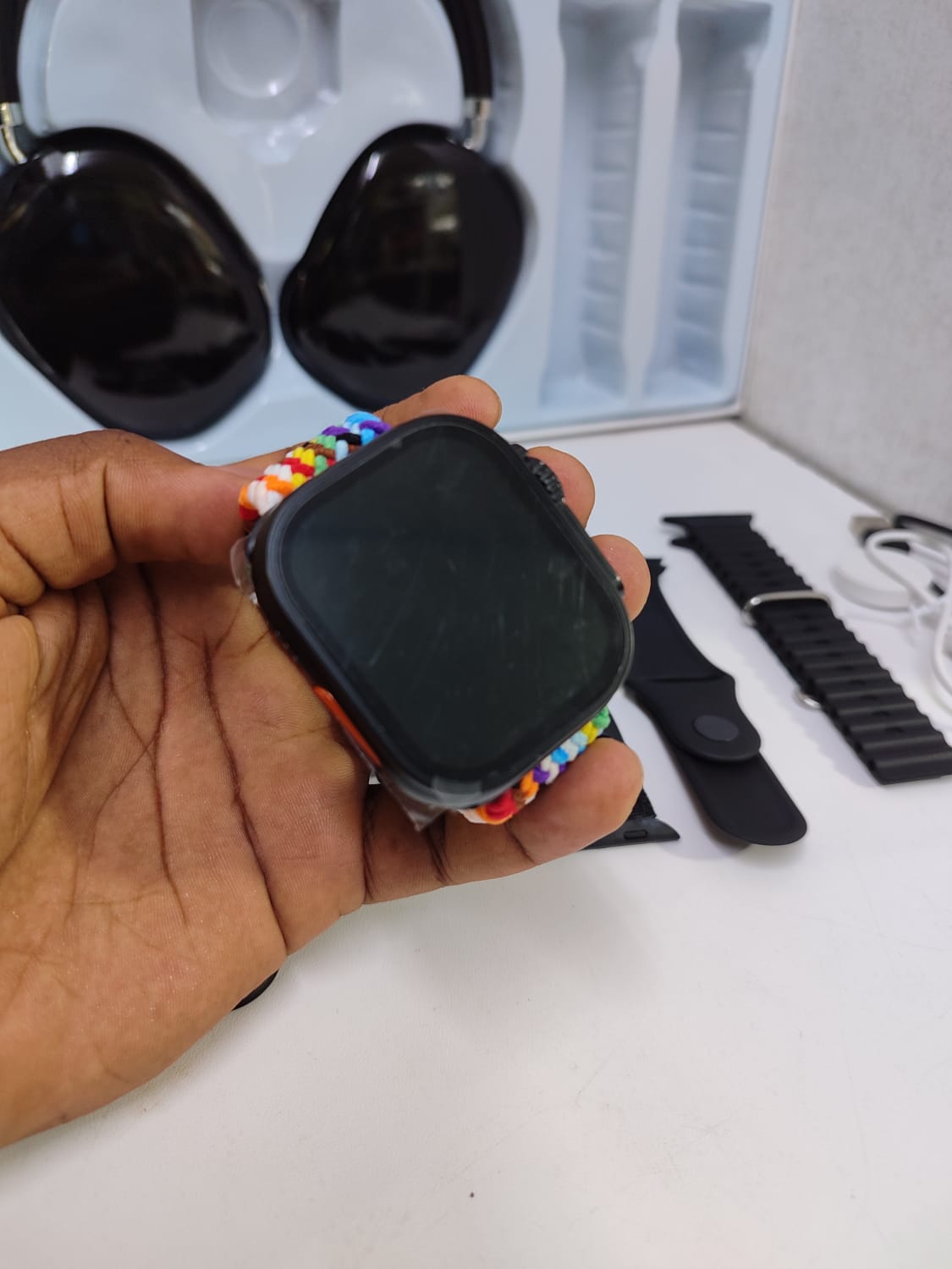 9-in-1 Ultra 2 smartwatch with 7 interchangeable straps and P9 Bluetooth headphones