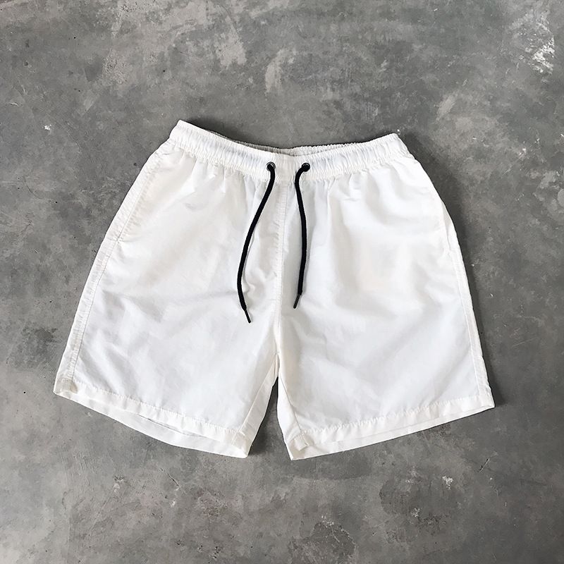 Ice Silk men's beach shorts Light breathable Summer sports shorts Candy color Surf Swimming loose sports shorts Extra large size