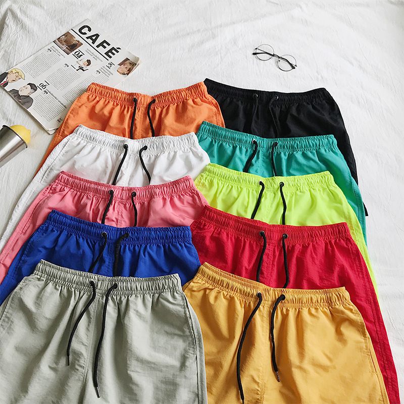 Ice Silk men's beach shorts Light breathable Summer sports shorts Candy color Surf Swimming loose sports shorts Extra large size