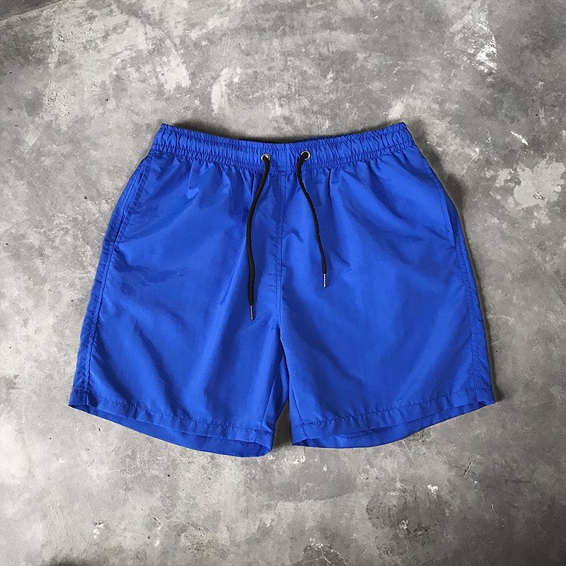 Ice Silk men's beach shorts Light breathable Summer sports shorts Candy color Surf Swimming loose sports shorts Extra large size