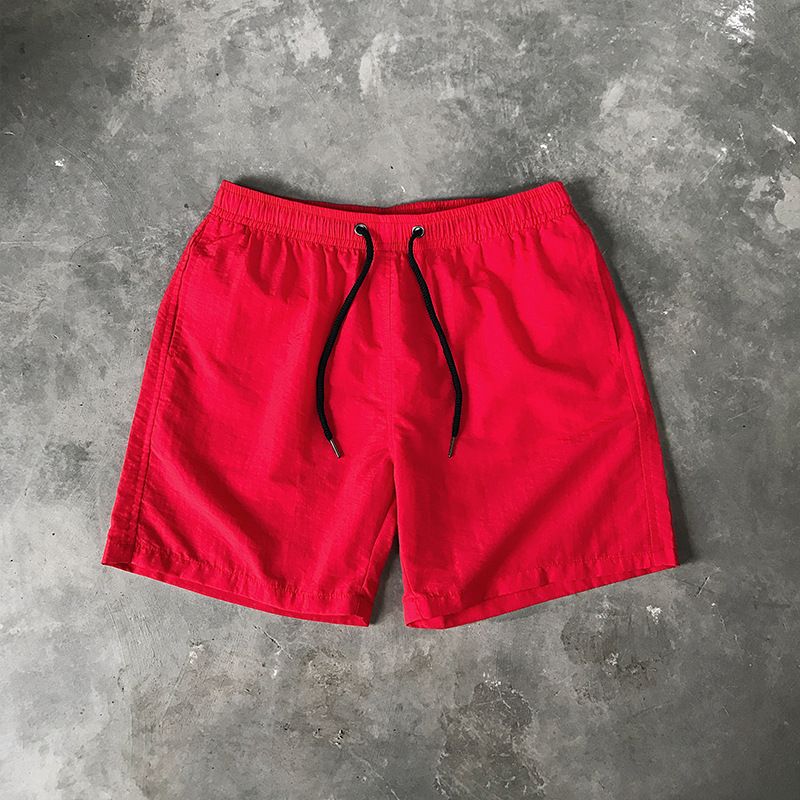 Ice Silk men's beach shorts Light breathable Summer sports shorts Candy color Surf Swimming loose sports shorts Extra large size