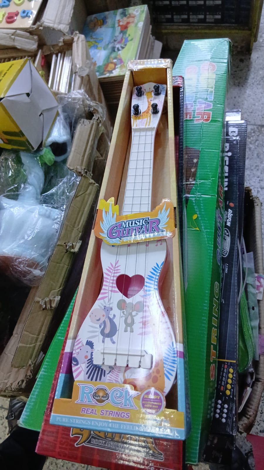 LET'S KIDS PERFECT ON THEIR MUSICAL EXPERIENCE 🍇 🥂 Mini Musical Acoustic Guitar Toy For KidsMini Musical Guitar Toy For Kids is Cute & handy and easy to learn. It deliver hours of resounding fun
