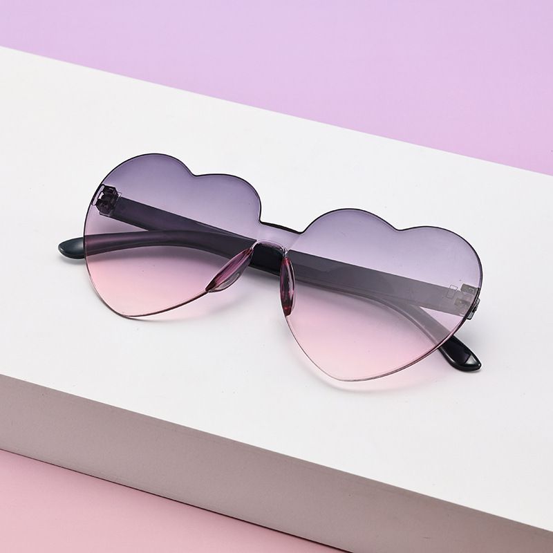 Borderless heart-shaped conjoined children's sunglasses jelly love baby sunglasses European and American candy colored peach heart children's glasses