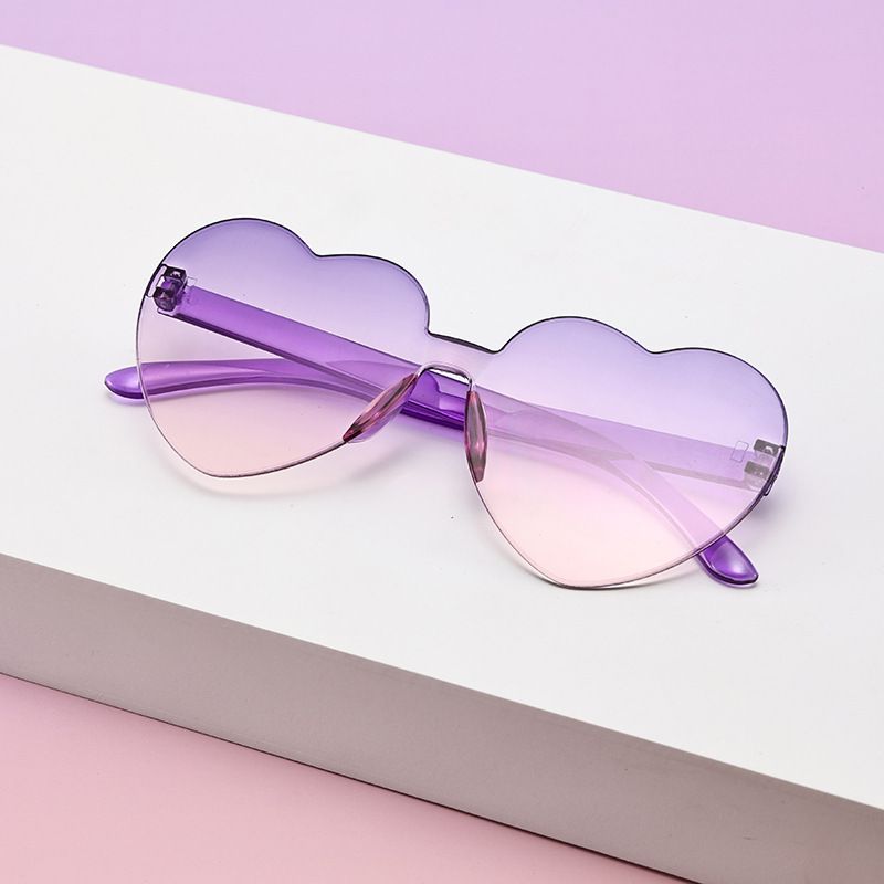 Borderless heart-shaped conjoined children's sunglasses jelly love baby sunglasses European and American candy colored peach heart children's glasses