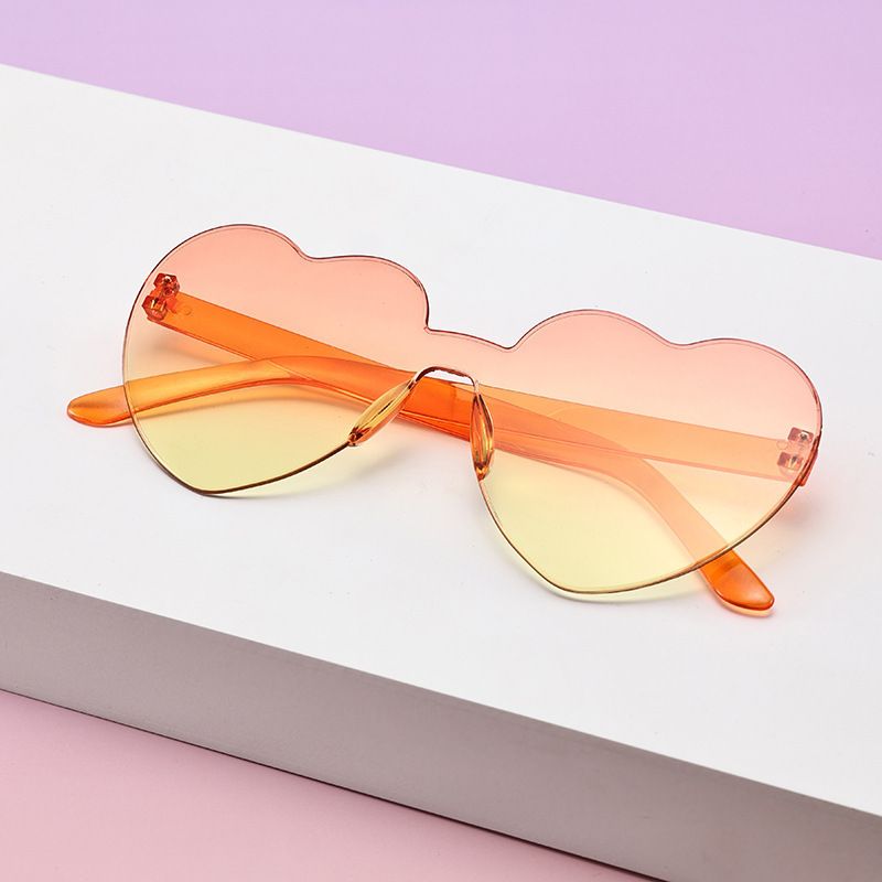 Borderless heart-shaped conjoined children's sunglasses jelly love baby sunglasses European and American candy colored peach heart children's glasses