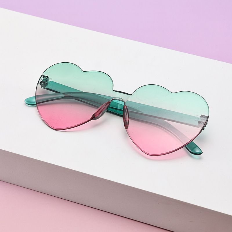 Borderless heart-shaped conjoined children's sunglasses jelly love baby sunglasses European and American candy colored peach heart children's glasses