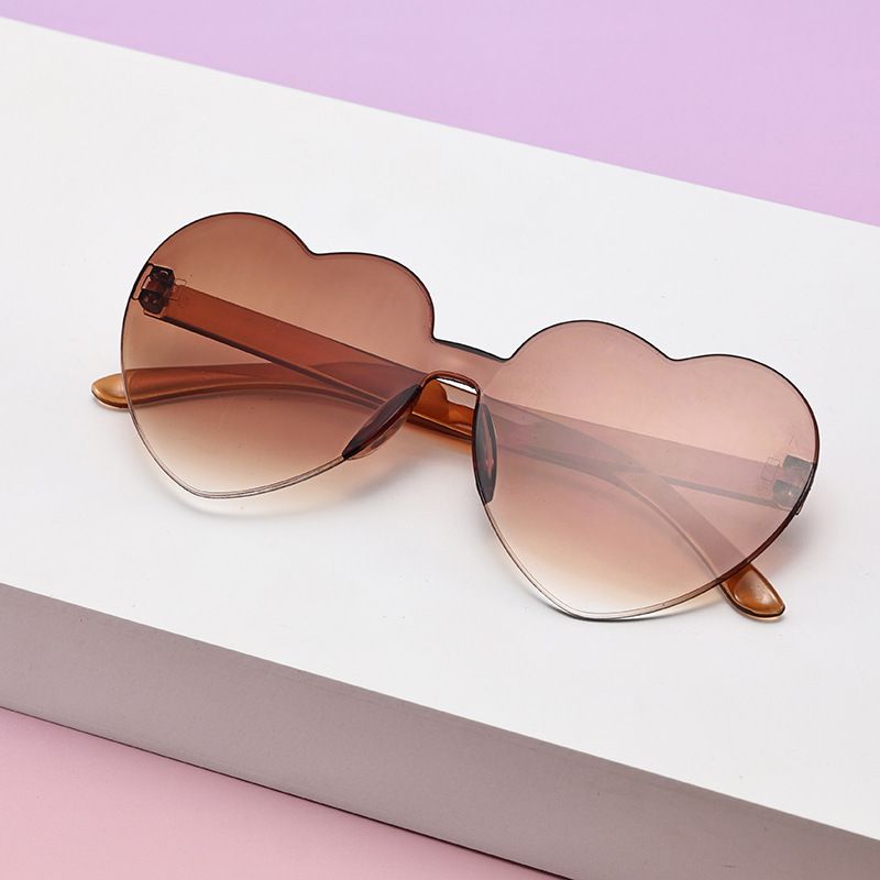 Borderless heart-shaped conjoined children's sunglasses jelly love baby sunglasses European and American candy colored peach heart children's glasses