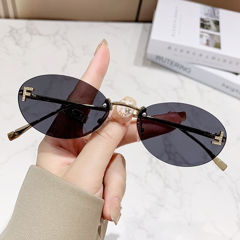 New letter F frameless sunglasses with diamond inlaid oval frame fashion sunglasses European and American trend small frame decoration sunscreen glasses