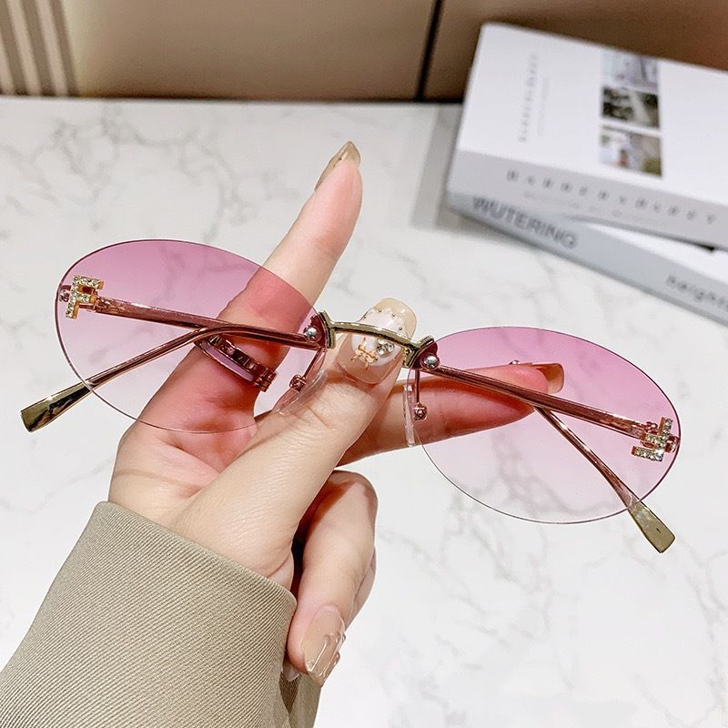 New letter F frameless sunglasses with diamond inlaid oval frame fashion sunglasses European and American trend small frame decoration sunscreen glasses