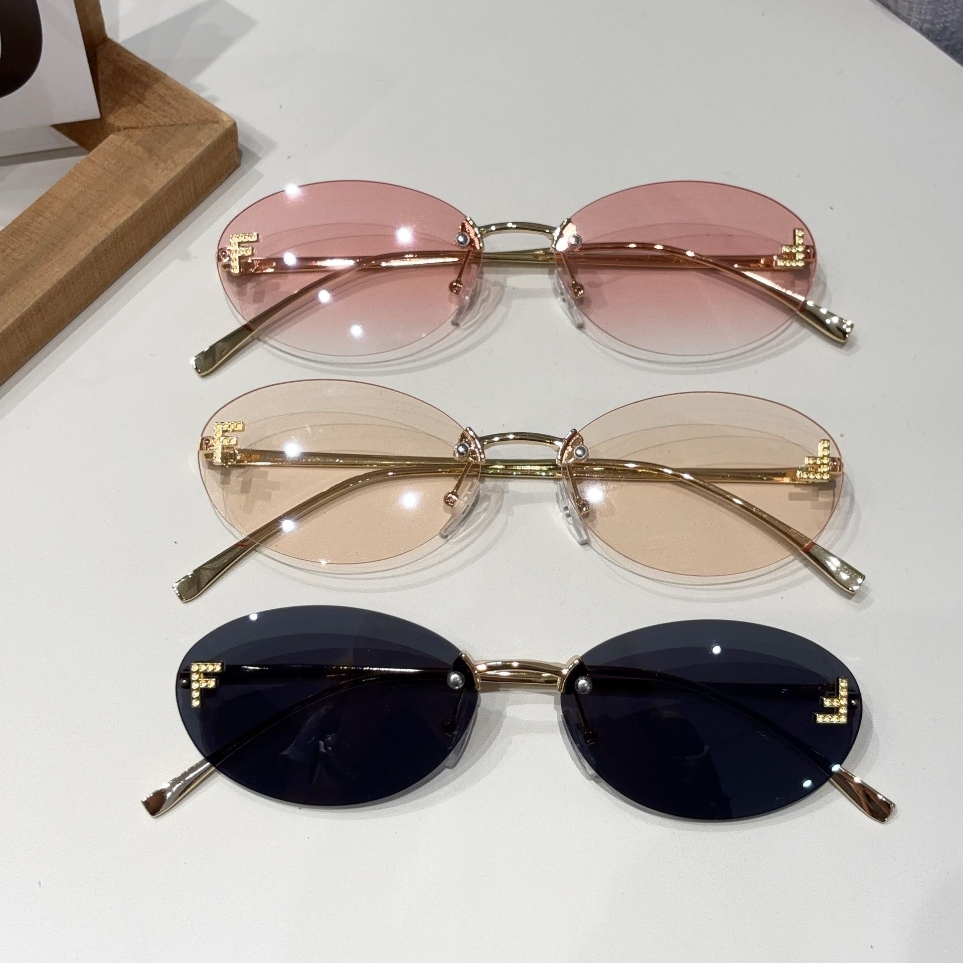 New letter F frameless sunglasses with diamond inlaid oval frame fashion sunglasses European and American trend small frame decoration sunscreen glasses