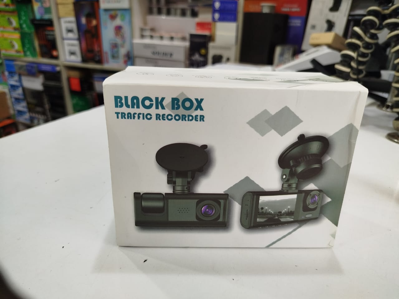 Black Box Traffic Recorder," which is a type of dash cam for vehicles. 
A black box traffic recorder is a high-definition dash camera designed to record traffic and vehicle movements. These devices of