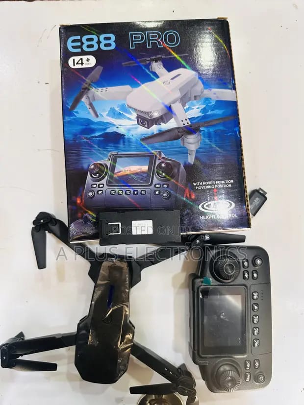 E88 Pro foldable quadcopter drone featuring a camera and a remote controller with an integrated screen for first-person view. 
Camera: Equipped with a 4K UHD camera.
Features: Includes altitude hold (