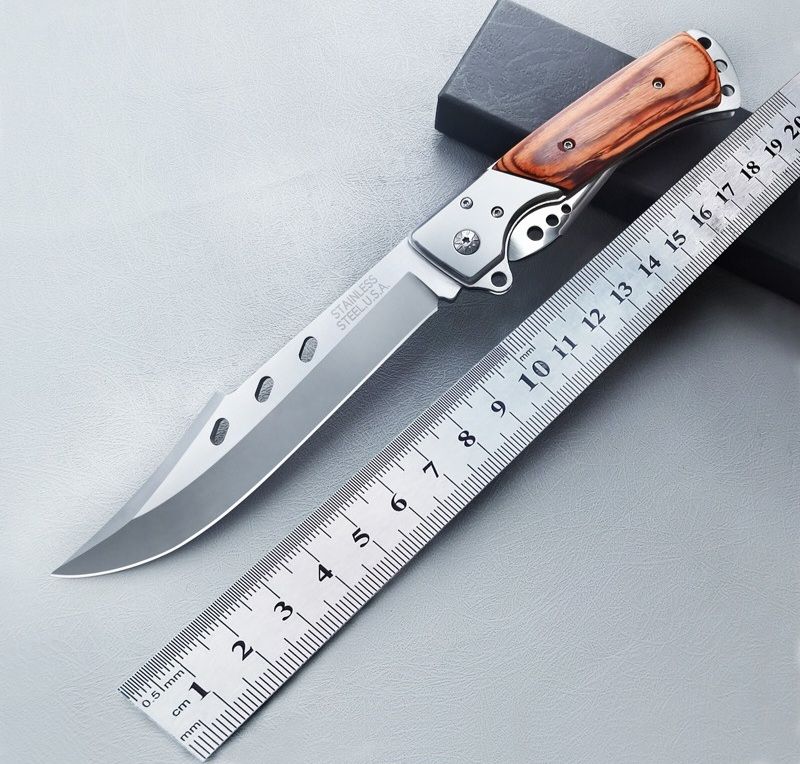 Folding knife for tourism, hunting, and fishing. Tough swiss outdoor knife with a nylon sheath.