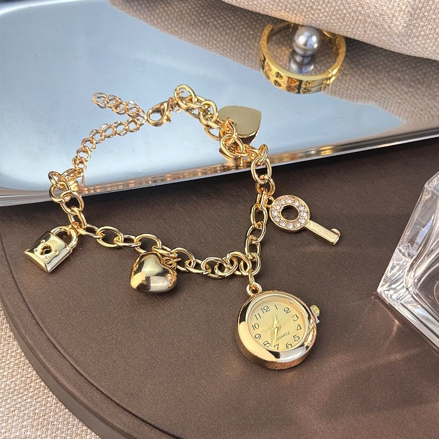 European and American love lock jewelry, personality, full of diamonds, peach heart, gold and silver bracelets, watches, women's diamond-set design, bracelets, quartz watches