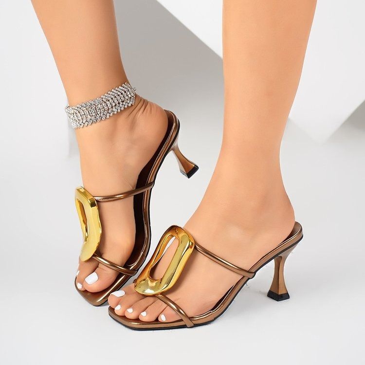 A woman wearing large-sized stiletto high heels for cross-border trade, a woman wearing metal square buckle one-line slippers, a woman wearing square-toed open-toe sandals on the outside, and a woman