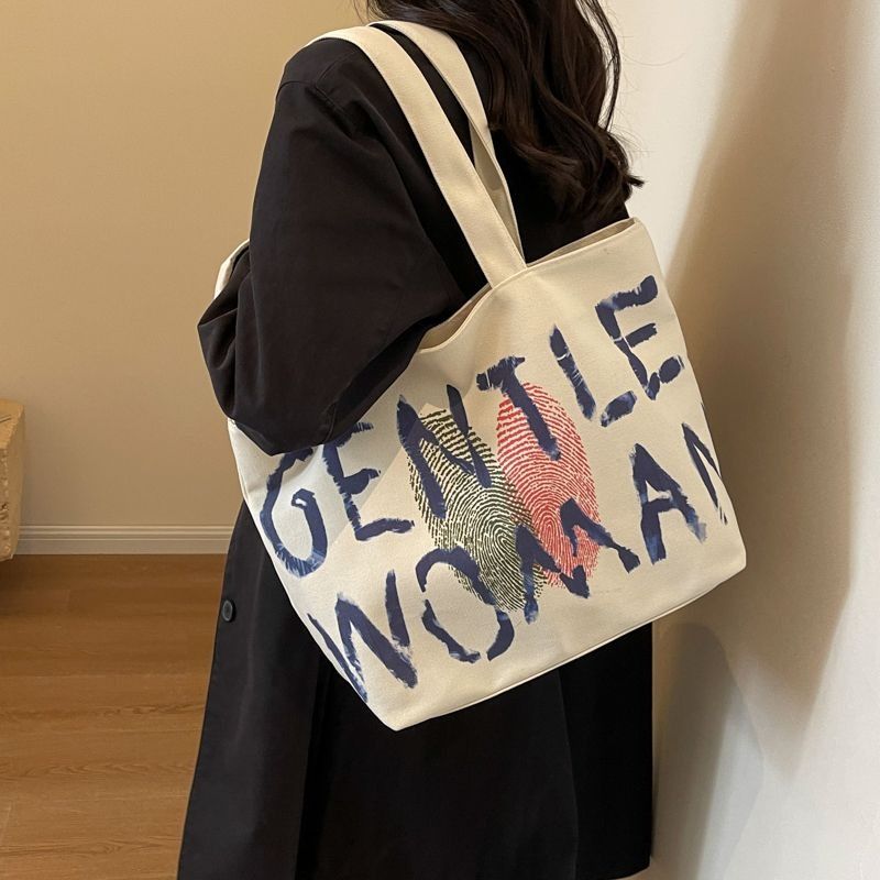 Student Women 2025 Shoulder bag Large capacity Zipper Canvas bag shopping bag Fashion Tote bag Cool shoulder bag FBK delivery Fast Creativity Casual Simple Graffiti