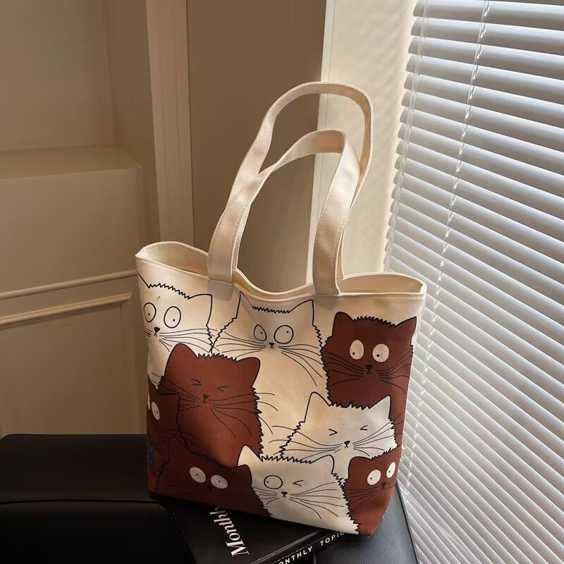 Tote bag Large capacity 2025 New style Cute kitten pattern Large capacity Single-shoulder canvas bag Foldable Women Girl Fashion School Shopping Leisure Washable