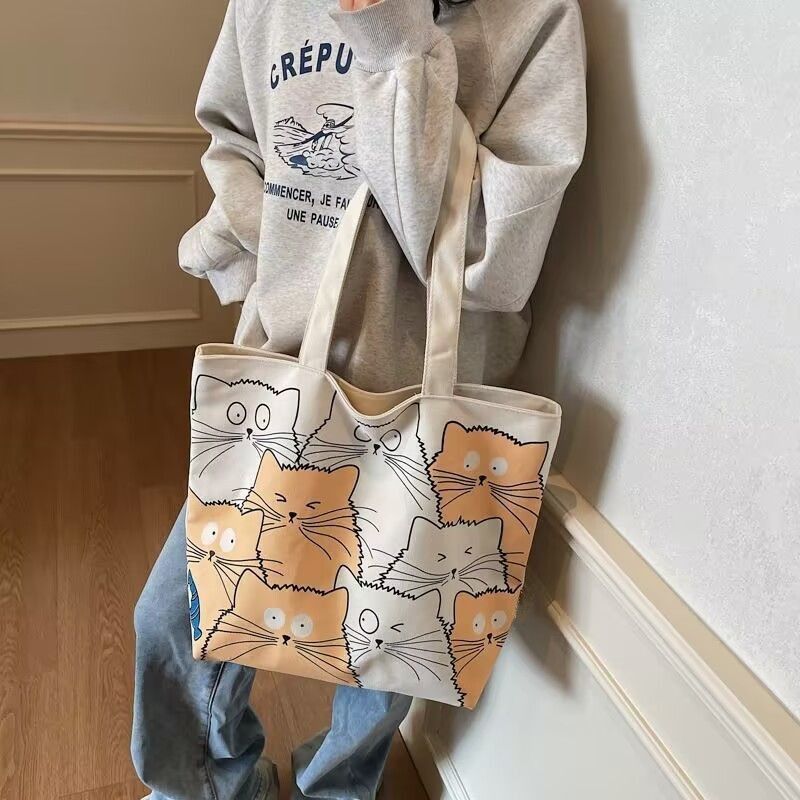 Tote bag Large capacity 2025 New style Cute kitten pattern Large capacity Single-shoulder canvas bag Foldable Women Girl Fashion School Shopping Leisure Washable