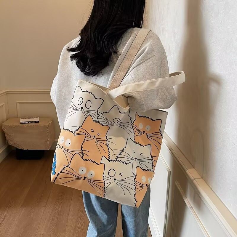 Tote bag Large capacity 2025 New style Cute kitten pattern Large capacity Single-shoulder canvas bag Foldable Women Girl Fashion School Shopping Leisure Washable