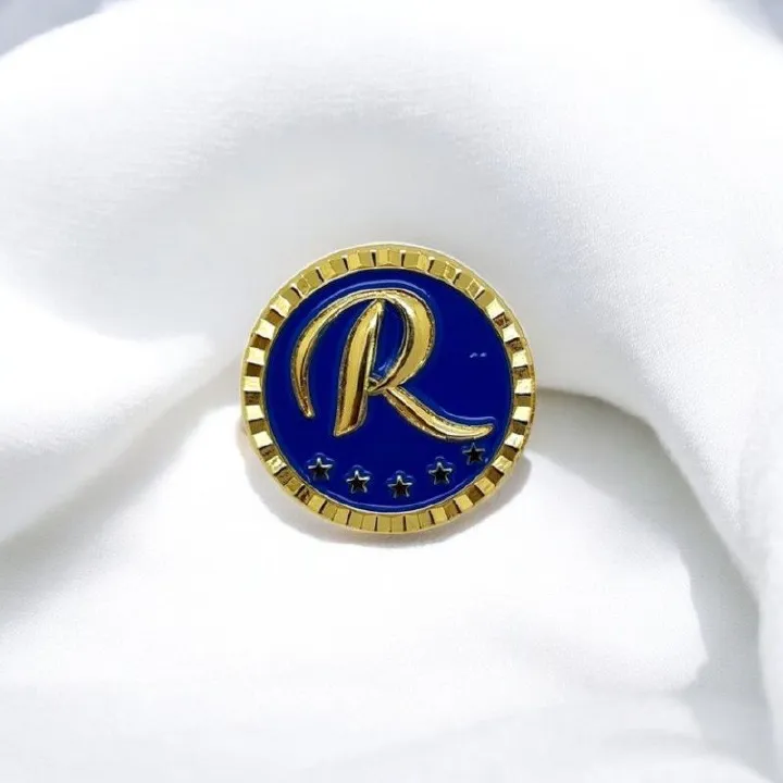 Raila Odinga Lapel Pin Badge – Premium Gold & Blue Political Memorabilia Pin with Iconic “R” and Star Design – Collectible & Stylish Accessory for Supporters & Enthusiasts