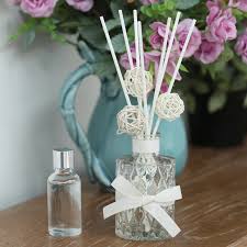 REED DIFFUSER/ home decor/ decor accents/ 3 reed sticks and a flower-refillable with essential oils of your choice