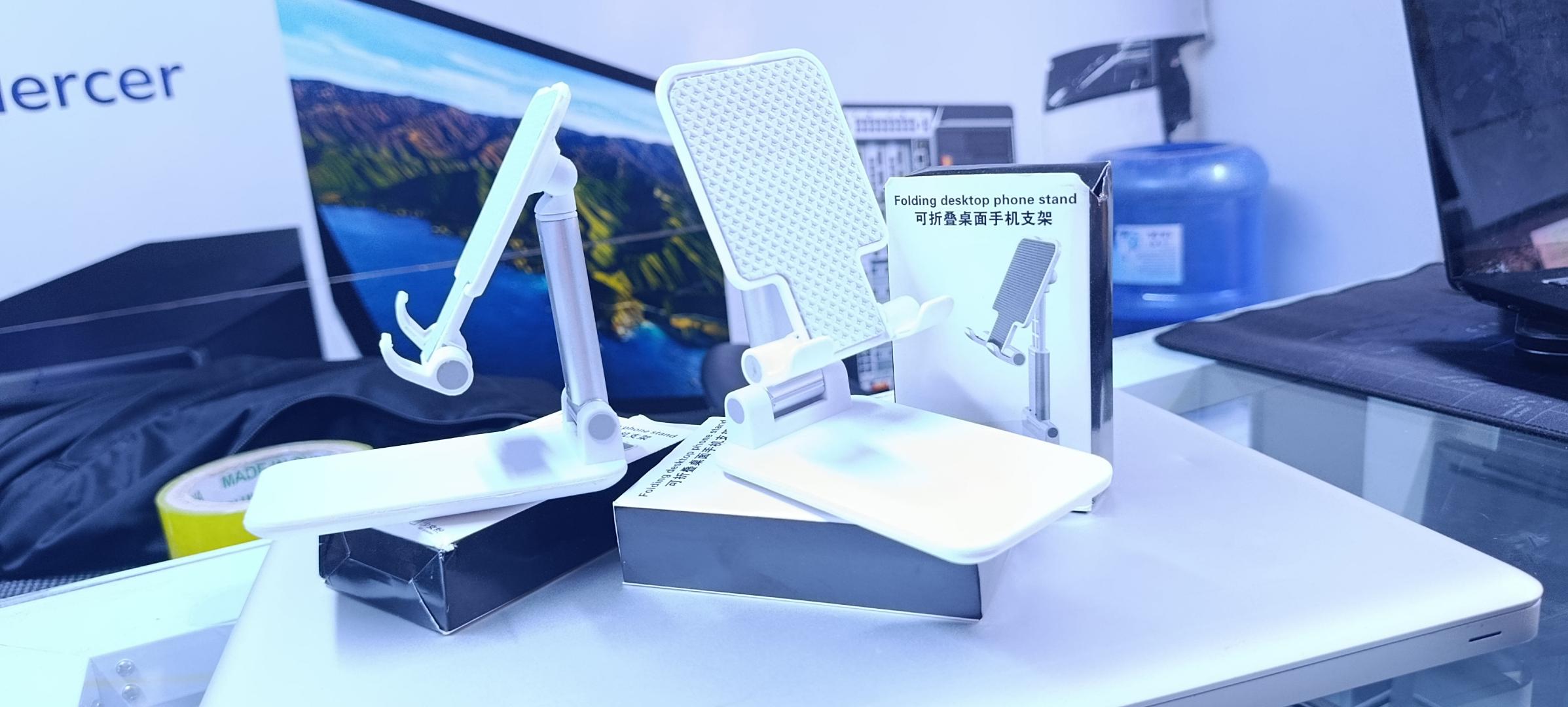 BRAND NEW FOLDABLE DESKTOP PHONE STAND HOLDER WHITE IN COLOR WITH A RUBBER HOLDER