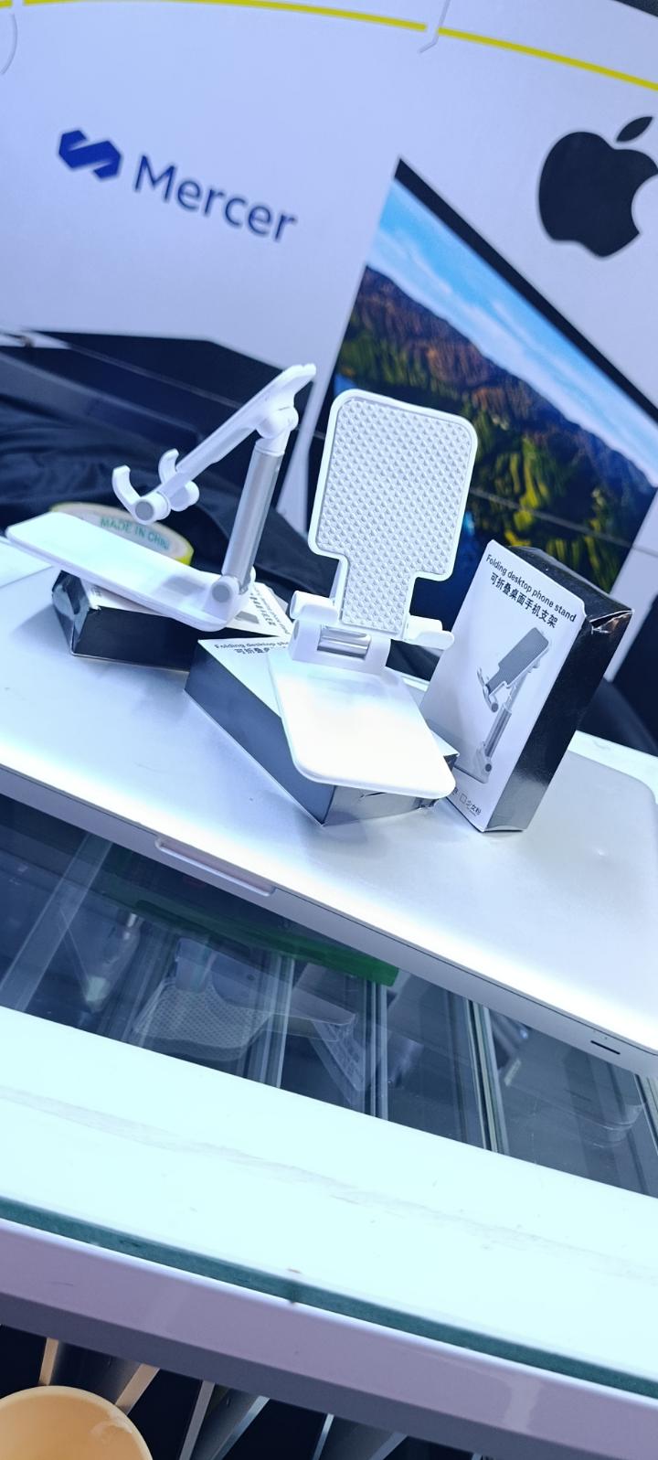 BRAND NEW FOLDABLE DESKTOP PHONE STAND HOLDER WHITE IN COLOR WITH A RUBBER HOLDER