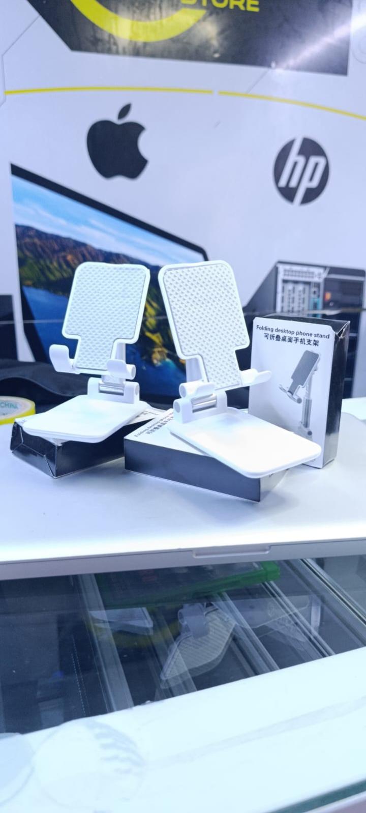 BRAND NEW FOLDABLE DESKTOP PHONE STAND HOLDER WHITE IN COLOR WITH A RUBBER HOLDER