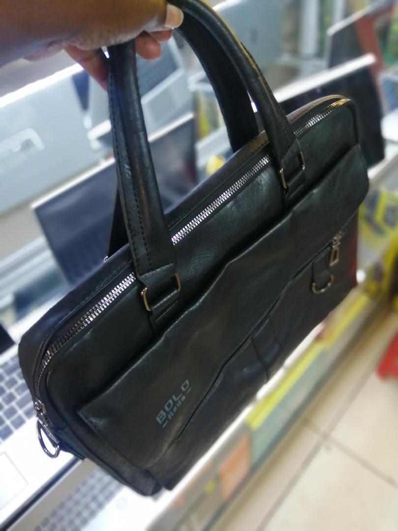 A sleek and spacious leather sling bag with a wide-zip design, perfect for laptops, travel, work, and daily use. Stylish, durable, and comfortable to carry