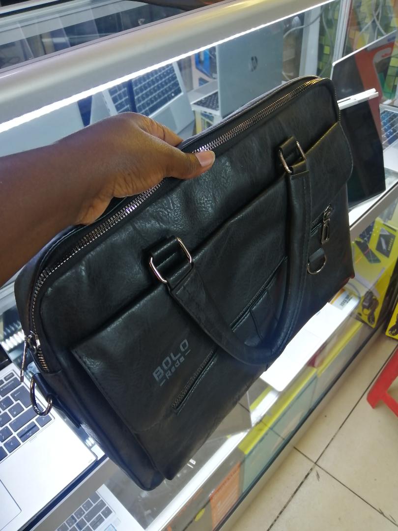 A sleek and spacious leather sling bag with a wide-zip design, perfect for laptops, travel, work, and daily use. Stylish, durable, and comfortable to carry