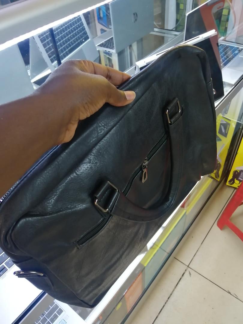 A sleek and spacious leather sling bag with a wide-zip design, perfect for laptops, travel, work, and daily use. Stylish, durable, and comfortable to carry