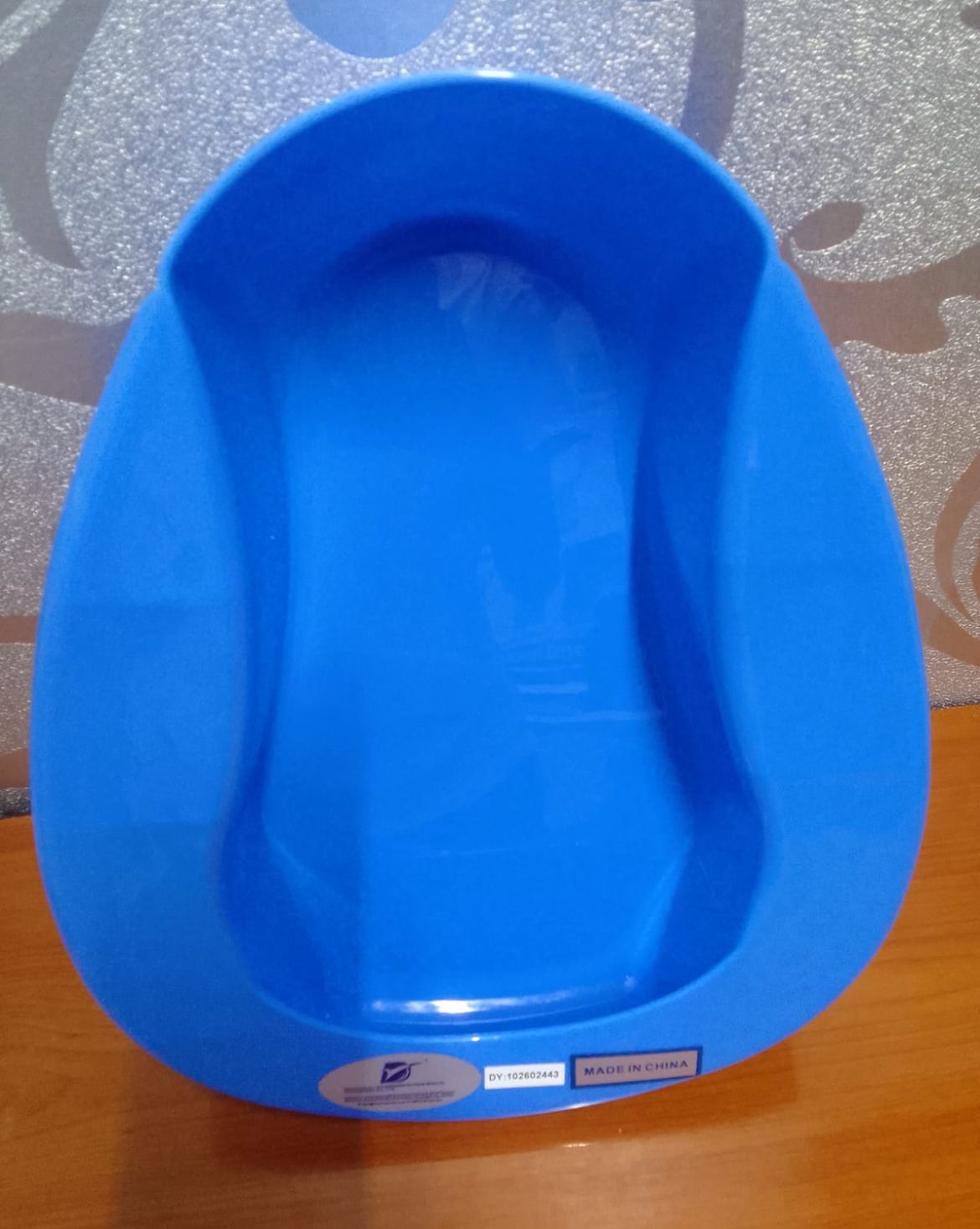 Medical Adorned Plastic Bedpan Bed Pans Multipurpose Easy Use.  A plastic bedpan Is a container used to collect urine and feaces from a person who cannot get out of the bed.