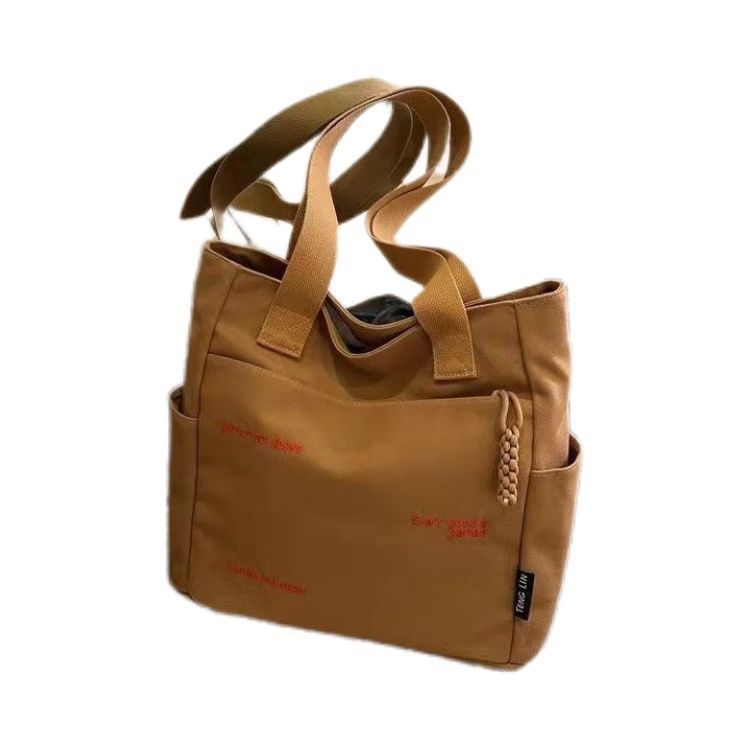 【Good Quality】Canvas bag women's men's new trendy embroidery letter handbag student large capacity single shoulder tote bag office commuter crossbody bag