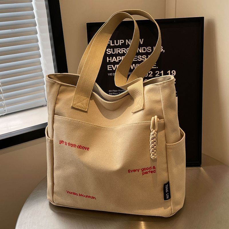 【Good Quality】Canvas bag women's men's new trendy embroidery letter handbag student large capacity single shoulder tote bag office commuter crossbody bag