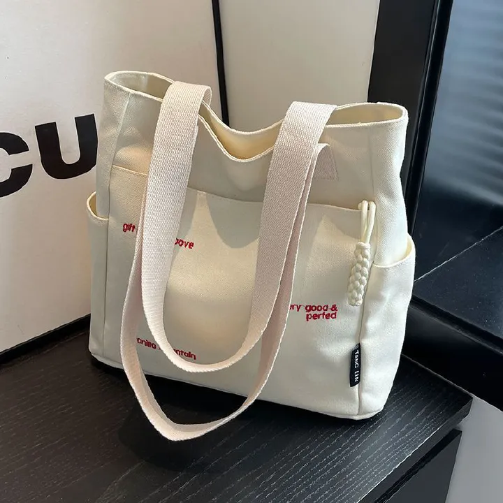 【Good Quality】Canvas bag women's men's new trendy embroidery letter handbag student large capacity single shoulder tote bag office commuter crossbody bag