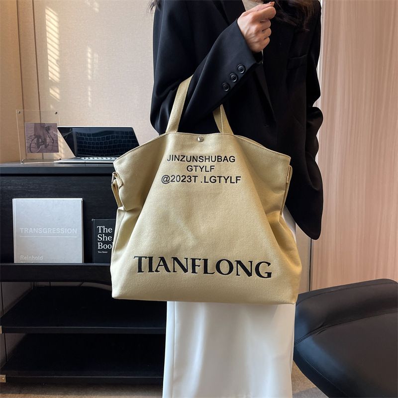 Casual shoulder crossbody bag for women commuting, large capacity student handbag, simple and lazy style, women's canvas tote bag