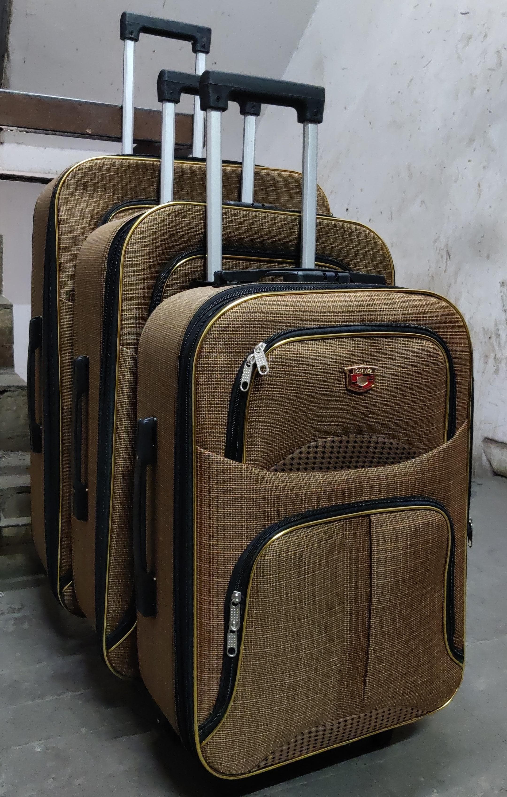 3 in 1 Pioneer traveling bag suitcase  Stylish travel suitcase made from durable fabric. It comes with a set of 180-degree wheels for convenient movement.