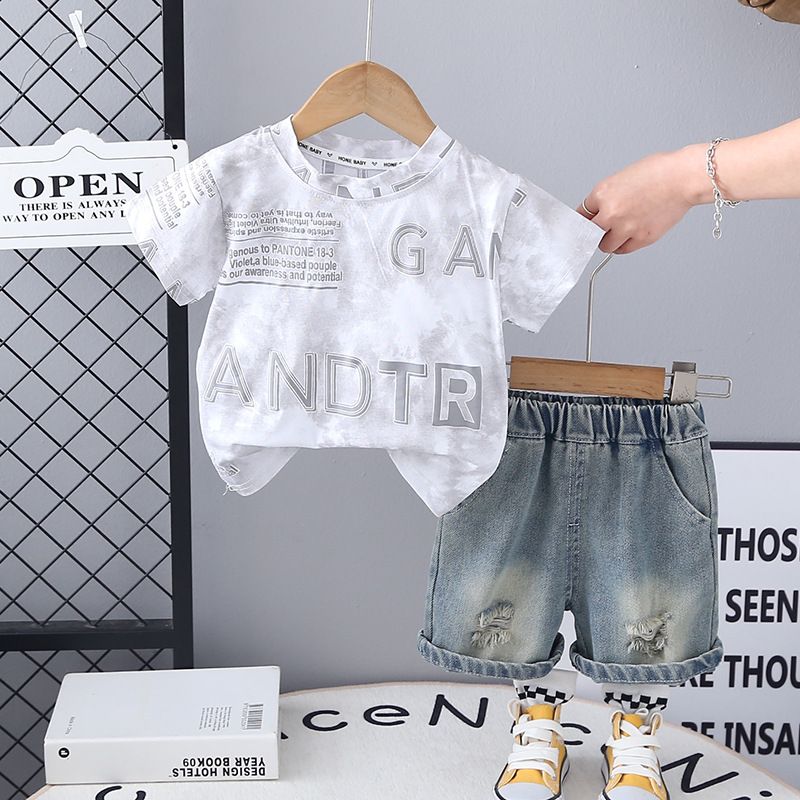 Summer new boys' two-piece set children's summer clothing tie dye letter short sleeved+ripped denim shorts set trendy