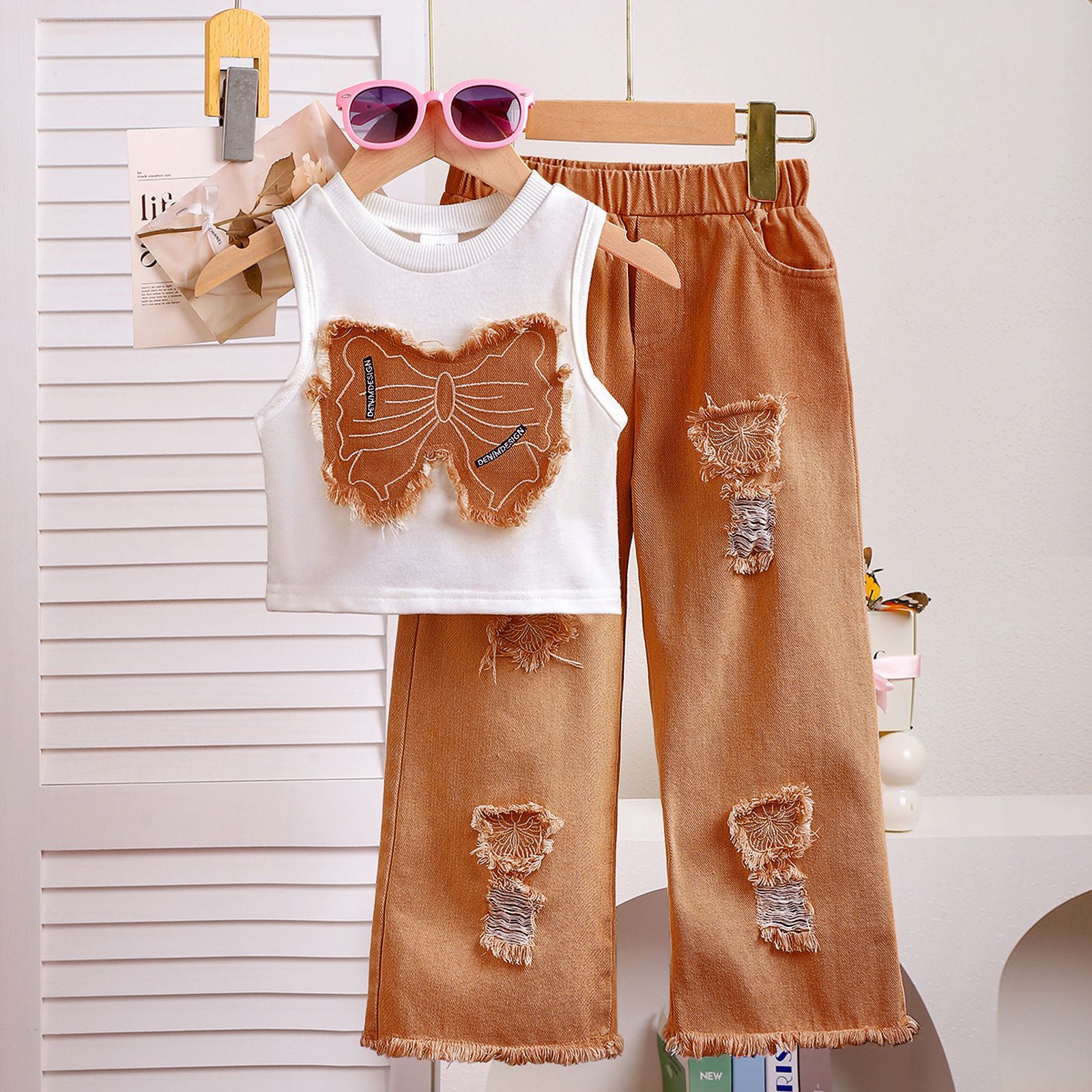 Girls' clothing set European and American summer girls' sleeveless patchwork bow top, ripped denim pants two-piece set