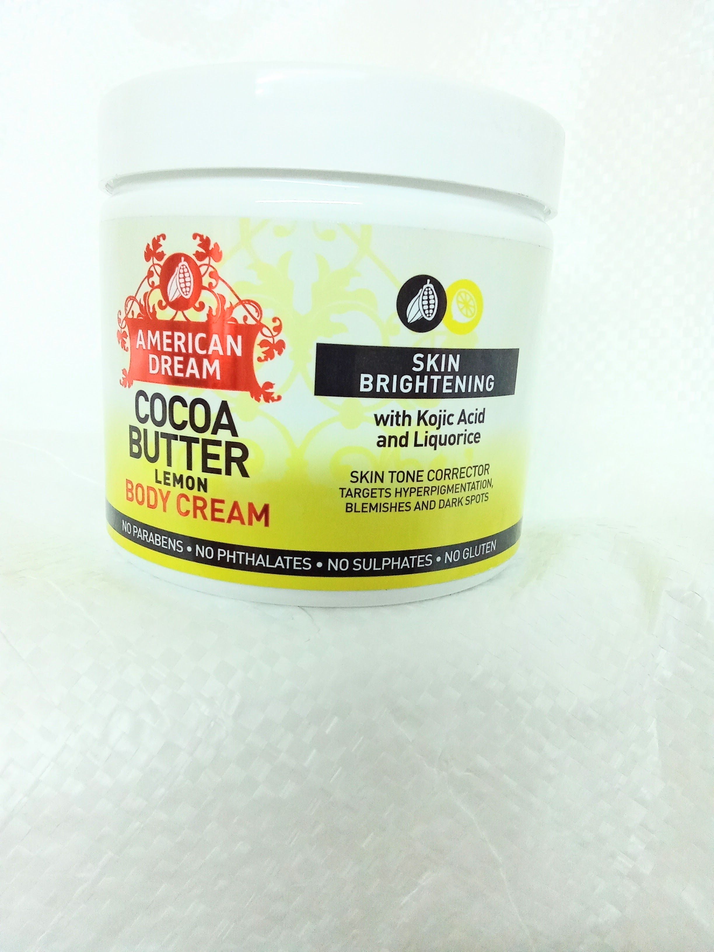 American dream cocoa butter lemon body cream rich in lemon oil acts as antibacteria kojic acid brightens clear dark spots Cocoa butter moisturize soften nourish skin licorice protect against sun damag
