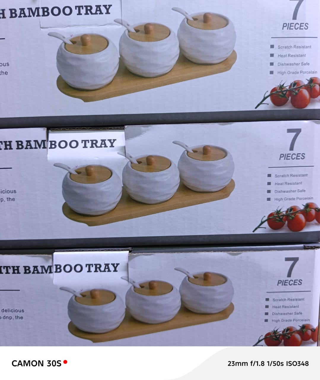 Ceramic Spice Jar Set with Bamboo Lids and Spoons. 
Material: High-grade porcelain ceramic jars with bamboo lids and a bamboo serving tray. 
Set Includes: Three spice jars, three spoons, and one bambo