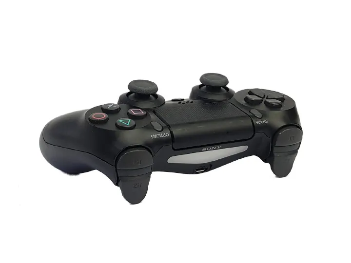 Wireless controller, Sony PS4 Pad Dual Shock 4. The DualShock 4 has new buttons in addition to the same general structure and button configuration as previous DualShock controllers