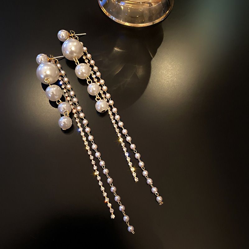 Diamond studded pearl tassel earrings, European and American personalized long earrings, fashionable temperament, trendy earrings