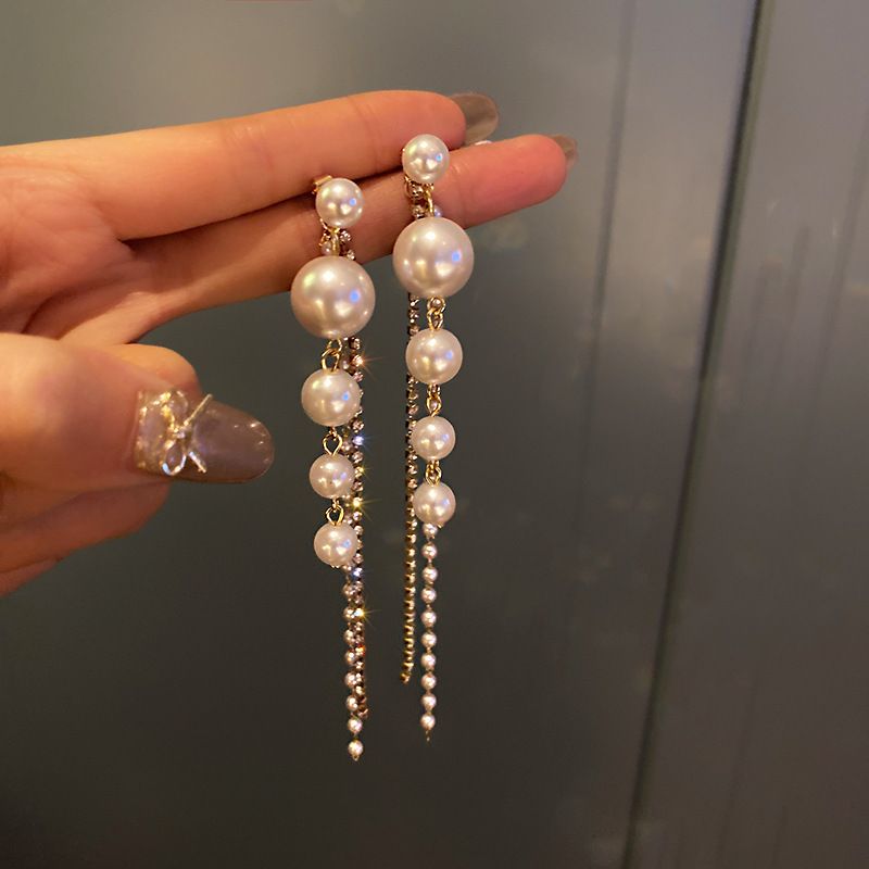 Diamond studded pearl tassel earrings, European and American personalized long earrings, fashionable temperament, trendy earrings