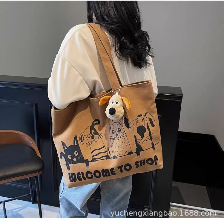 Leisure large capacity canvas bag for women 2025 new lightweight and versatile commuting shoulder bag graffiti tote bag
